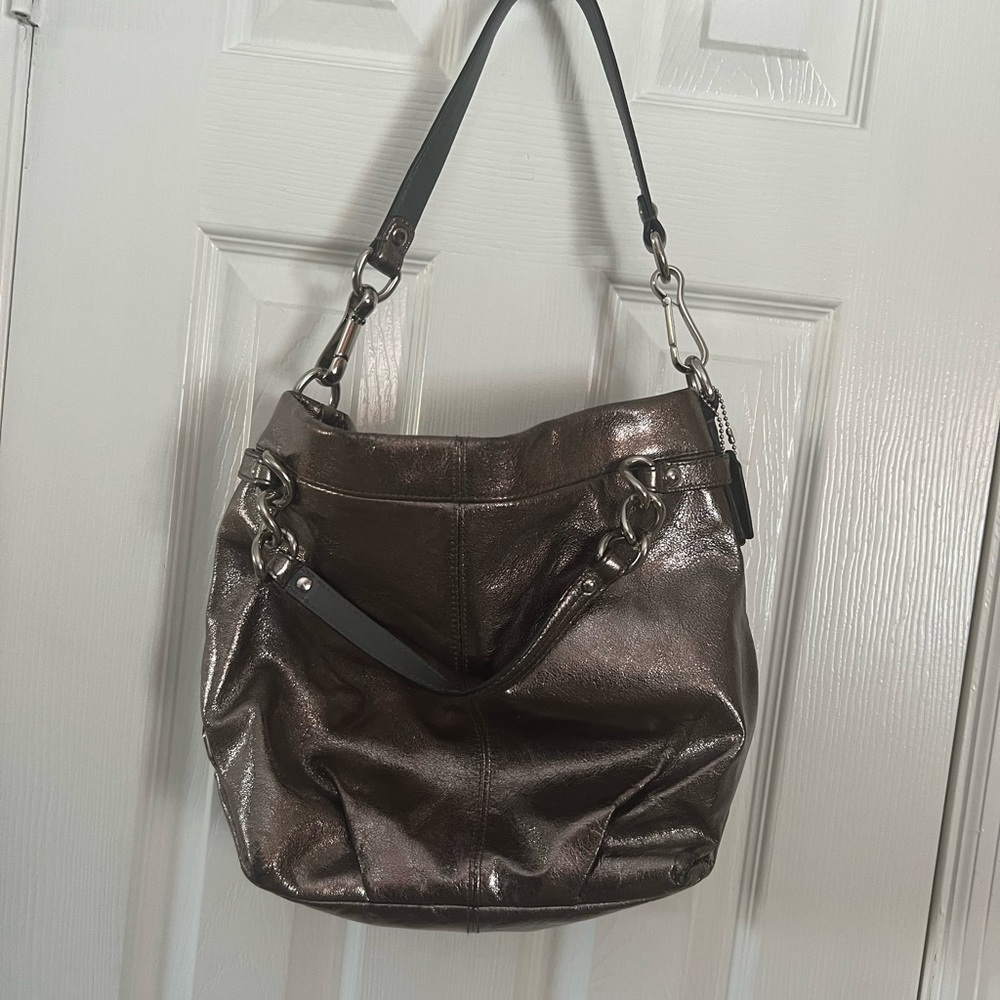 Midsize silver Coach slouch purse. Fantastic find and goes with everything!